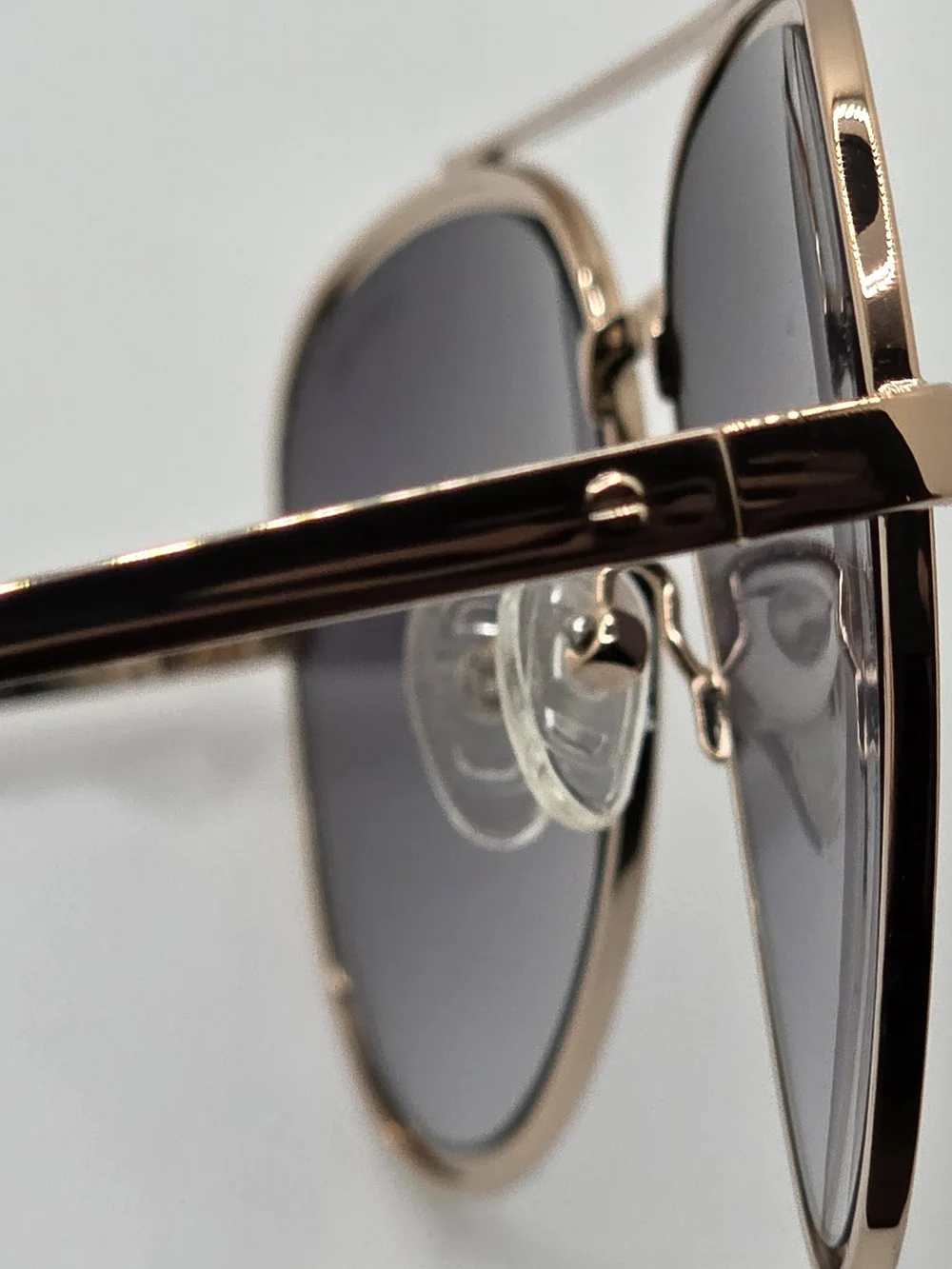 Kenneth Cole Rose Gold Aviator Sunglasses with Dark Gradient Lenses